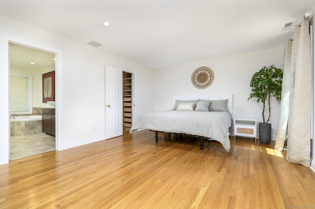 7 Castlewood Dr Unit 7, Monroe, CT 06468 - bedroom with light wood-style flooring, recessed lighting, and connected bathroom
