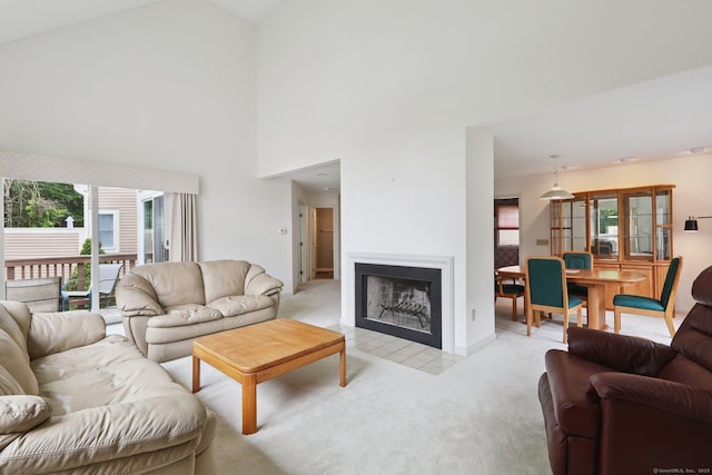 17 Brittania Dr Unit 17, Danbury, CT 06811 - living area featuring light colored carpet, plenty of natural light, a fireplace with flush hearth, and high vaulted ceiling