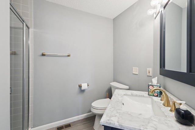 17 Brittania Dr Unit 17, Danbury, CT 06811 - full bathroom featuring wood finished floors, tiled shower, vanity, and a textured ceiling