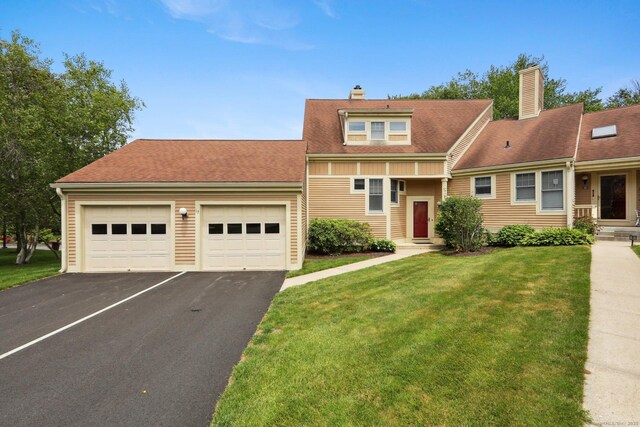 17 Brittania Dr Unit 17, Danbury, CT 06811 - view of front of house featuring asphalt driveway, a chimney, a front lawn, and roof with shingles