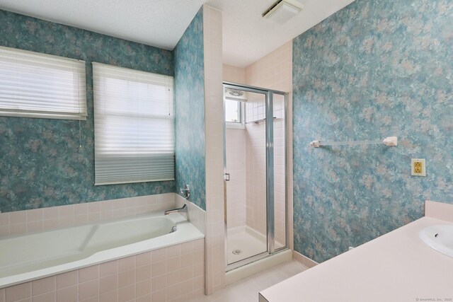 17 Brittania Dr Unit 17, Danbury, CT 06811 - bathroom with a shower stall, a garden tub, wallpapered walls, and tile patterned floors