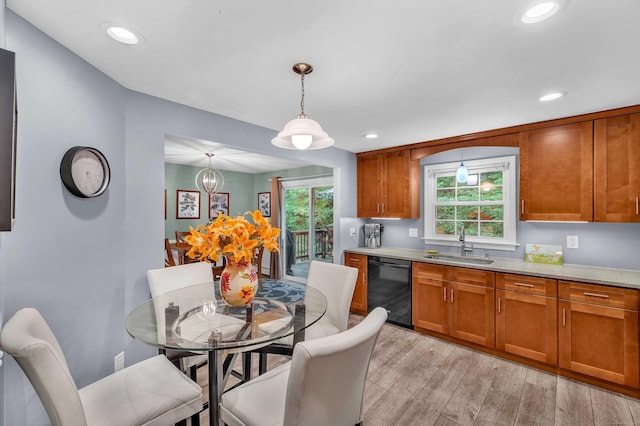 81 Charter Oak Dr, East Lyme, CT 06333 - kitchen featuring black dishwasher, brown cabinets, light wood finished floors, pendant lighting, and recessed lighting
