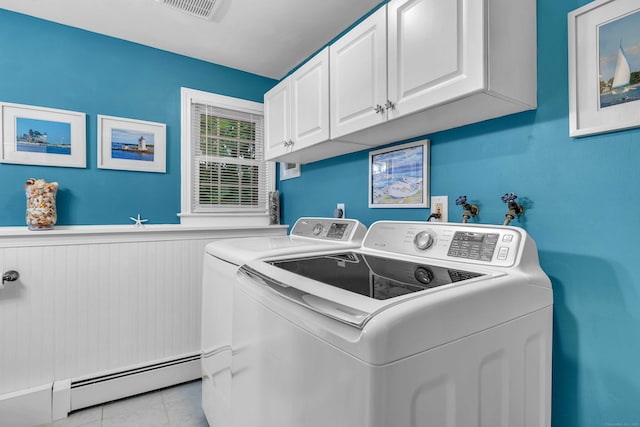 81 Charter Oak Dr, East Lyme, CT 06333 - laundry area featuring baseboard heating, independent washer and dryer, a wainscoted wall, cabinet space, and light tile patterned flooring