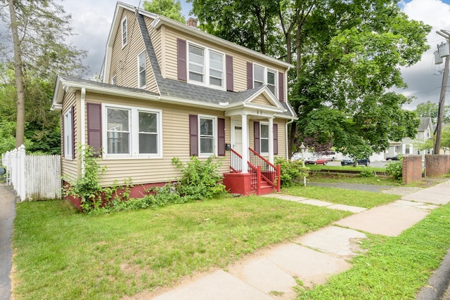 49 Olmsted St, East Hartford, CT 06108 - colonial inspired home with roof with shingles and a chimney