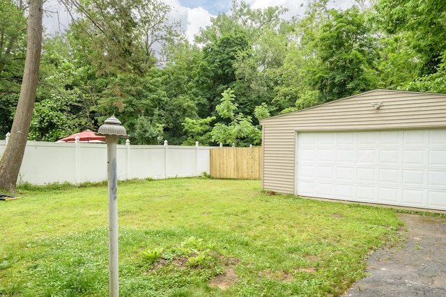 49 Olmsted St, East Hartford, CT 06108 - view of yard featuring an outbuilding and a detached garage