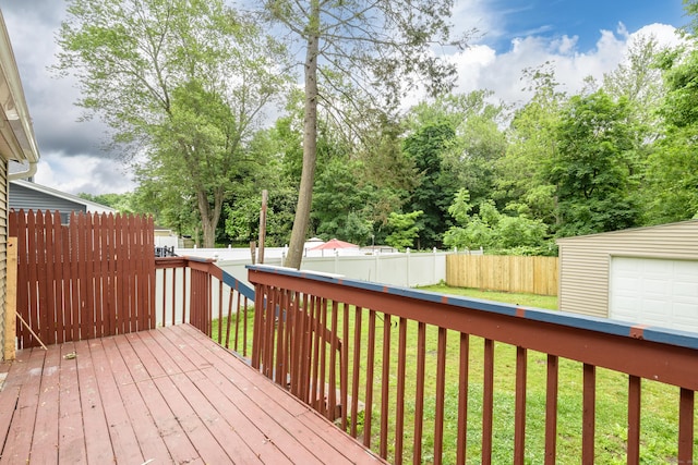 49 Olmsted St, East Hartford, CT 06108 - deck featuring a fenced backyard, an outbuilding, and view of scattered trees