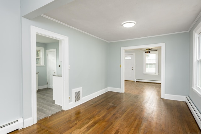 49 Olmsted St, East Hartford, CT 06108 - spare room featuring baseboard heating, crown molding, dark wood-style flooring, a baseboard heating unit, and a ceiling fan