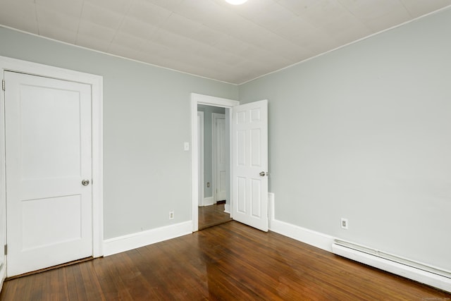 49 Olmsted St, East Hartford, CT 06108 - unfurnished bedroom featuring a baseboard heating unit and dark wood-style flooring
