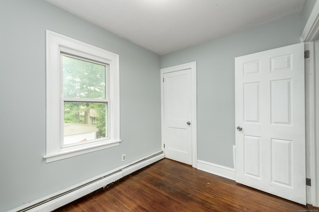 49 Olmsted St, East Hartford, CT 06108 - unfurnished bedroom featuring a baseboard radiator and dark wood-type flooring
