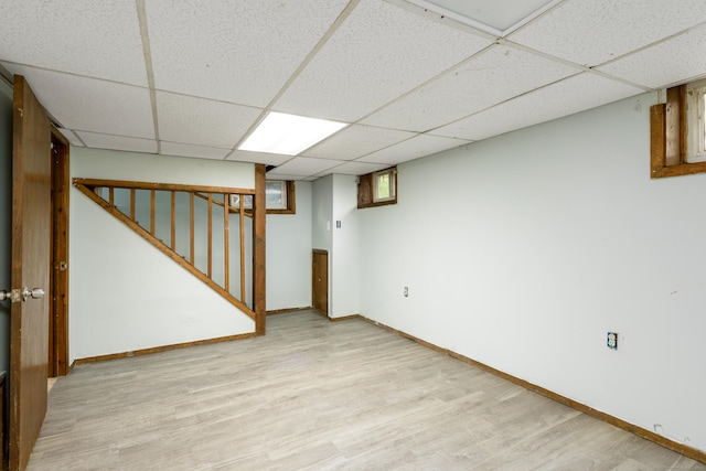 49 Olmsted St, East Hartford, CT 06108 - basement with a paneled ceiling, light wood-style floors, and stairs
