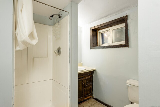 49 Olmsted St, East Hartford, CT 06108 - bathroom with a shower, vanity, and tile patterned flooring