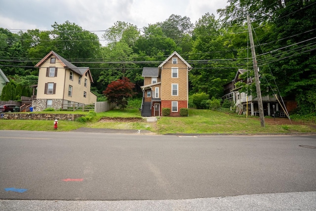 103 Clay St, Thomaston, CT 06787 - view of front of house featuring a front lawn and brick siding