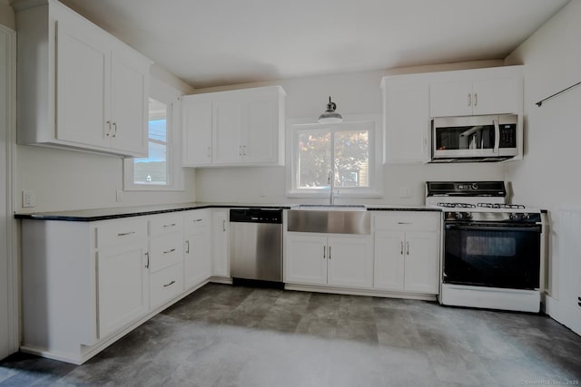 103 Clay St, Thomaston, CT 06787 - kitchen with appliances with stainless steel finishes, dark countertops, and white cabinets