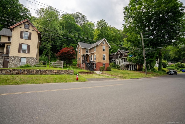 103 Clay St, Thomaston, CT 06787 - view of front of home featuring stone siding and a front lawn