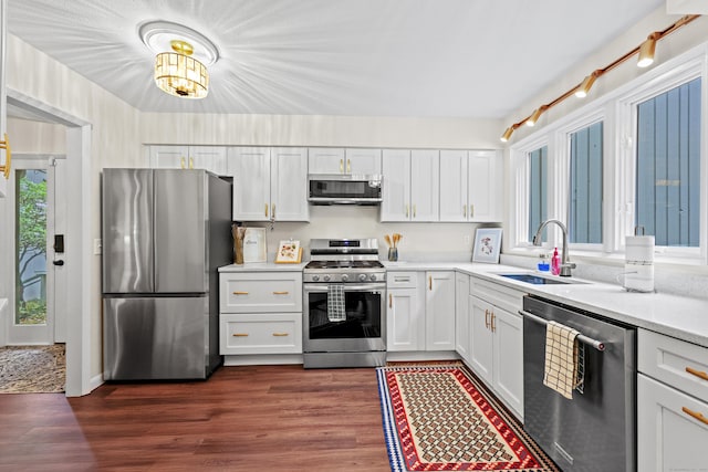 12 Byrne Ct Unit D, Farmington, CT 06032 - kitchen with stainless steel appliances, light countertops, white cabinets, and dark wood-style flooring