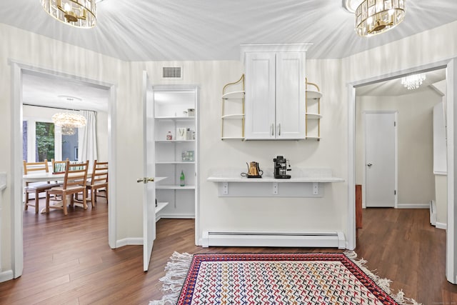 12 Byrne Ct Unit D, Farmington, CT 06032 - kitchen featuring a chandelier, open shelves, a baseboard radiator, white cabinets, and dark wood finished floors