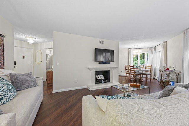 12 Byrne Ct Unit D, Farmington, CT 06032 - living room with dark wood-style flooring, a chandelier, and baseboard heating