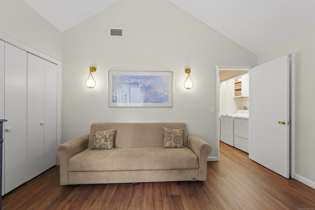 12 Byrne Ct Unit D, Farmington, CT 06032 - living room with washer and dryer, wood finished floors, and high vaulted ceiling