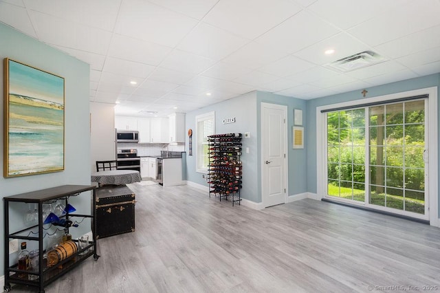 171 Judd Hill Rd, Middlebury, CT 06762 - living area featuring light wood-style floors and a drop ceiling