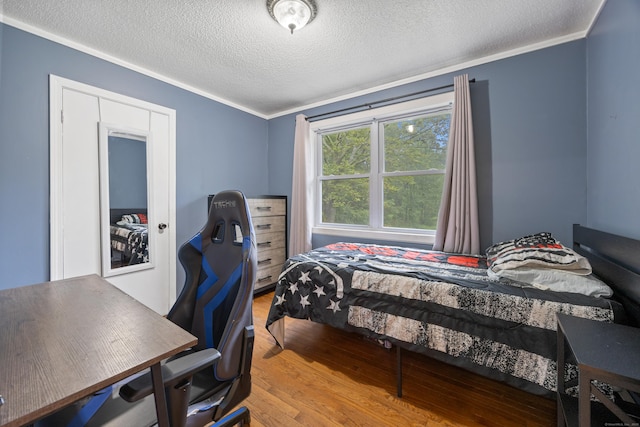 489 Thomaston Rd, Watertown, CT 06795 - bedroom with a textured ceiling, ornamental molding, wood finished floors, and a desk