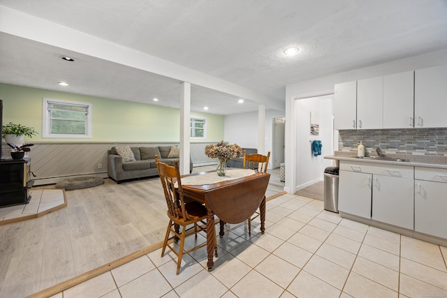 489 Thomaston Rd, Watertown, CT 06795 - dining area with a wainscoted wall, healthy amount of natural light, light wood finished floors, recessed lighting, and baseboard heating