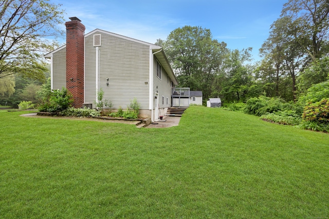 489 Thomaston Rd, Watertown, CT 06795 - view of home's exterior with a chimney, a yard, and a deck