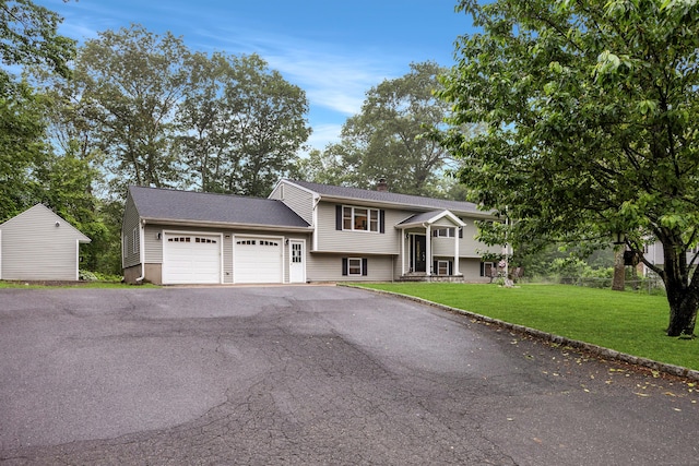 489 Thomaston Rd, Watertown, CT 06795 - view of front of home with an attached garage, driveway, a front lawn, and a chimney