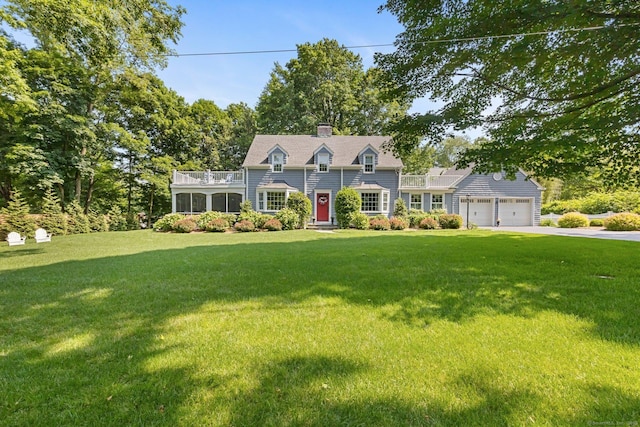 5 Lookout Rd, Norwalk, CT 06850 - view of front facade with concrete driveway, an attached garage, a front yard, and a chimney