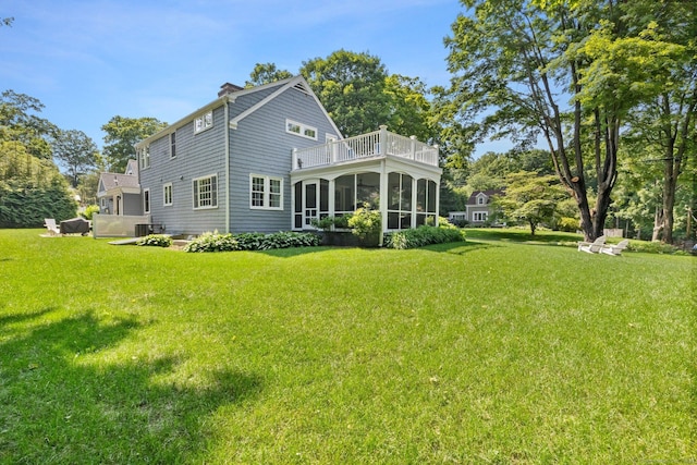 5 Lookout Rd, Norwalk, CT 06850 - rear view of property featuring a sunroom, a balcony, a lawn, and a chimney