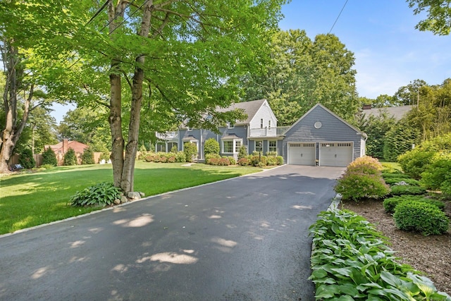 5 Lookout Rd, Norwalk, CT 06850 - view of front of property with asphalt driveway, a front lawn, and an attached garage