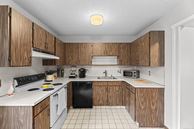 21 Heritage Cir Unit A, Southbury, CT 06488 - kitchen featuring white electric range oven, under cabinet range hood, black dishwasher, stainless steel microwave, and a textured ceiling