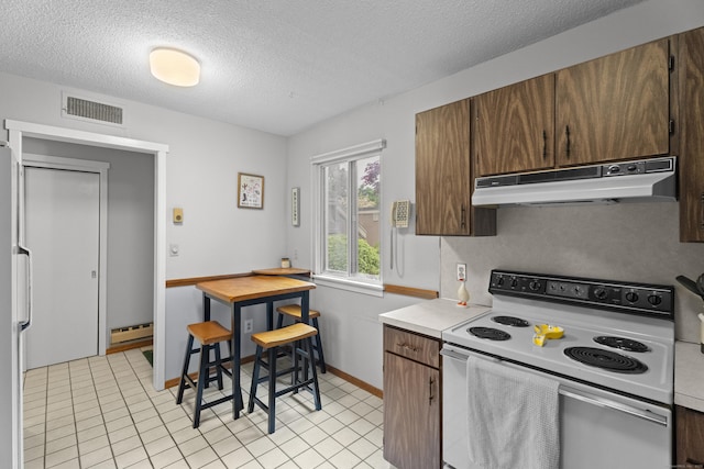 21 Heritage Cir Unit A, Southbury, CT 06488 - kitchen featuring white range with electric cooktop, under cabinet range hood, light countertops, a textured ceiling, and fridge