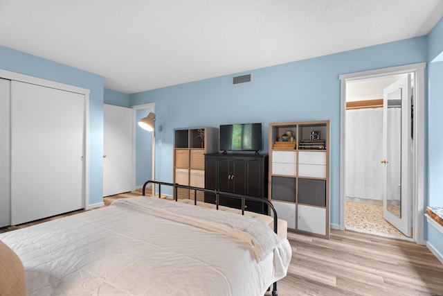 21 Heritage Cir Unit A, Southbury, CT 06488 - bedroom with wood finished floors, a closet, and connected bathroom
