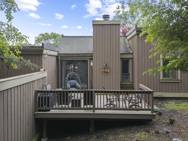 21 Heritage Cir Unit A, Southbury, CT 06488 - rear view of property featuring a chimney, a wooden deck, and roof with shingles