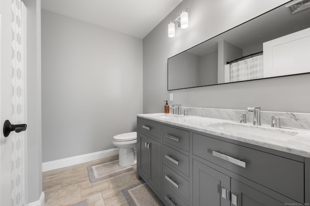 64 Scotch Cap Rd Unit 173, Waterford, CT 06375 - bathroom featuring baseboards and double vanity