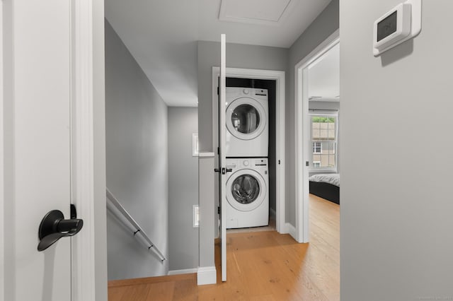 64 Scotch Cap Rd Unit 173, Waterford, CT 06375 - washroom featuring stacked washer and clothes dryer and wood finished floors