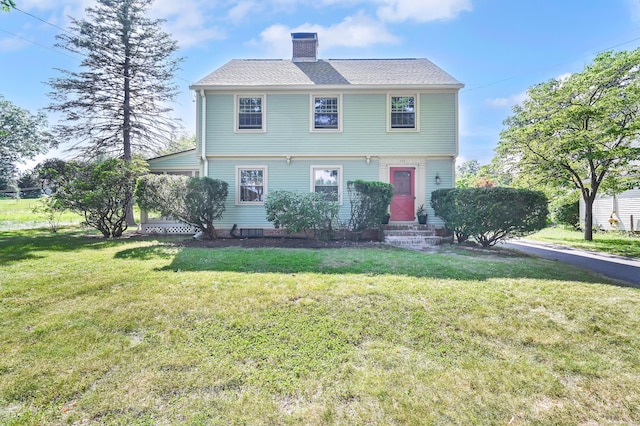 133 Griswold Rd, Wethersfield, CT 06109 - colonial-style house with a chimney, a front lawn, and entry steps
