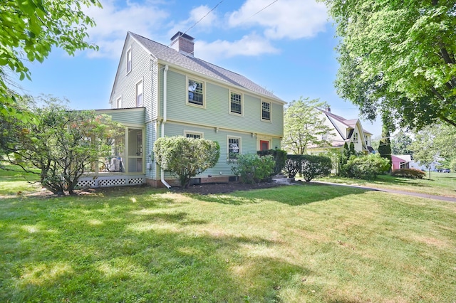 133 Griswold Rd, Wethersfield, CT 06109 - colonial home with a front lawn, a chimney, and a porch
