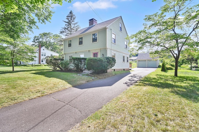 133 Griswold Rd, Wethersfield, CT 06109 - colonial inspired home featuring a garage, a chimney, an outbuilding, and a front yard