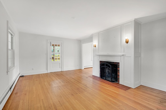 133 Griswold Rd, Wethersfield, CT 06109 - unfurnished living room featuring a baseboard radiator, a brick fireplace, and light wood finished floors