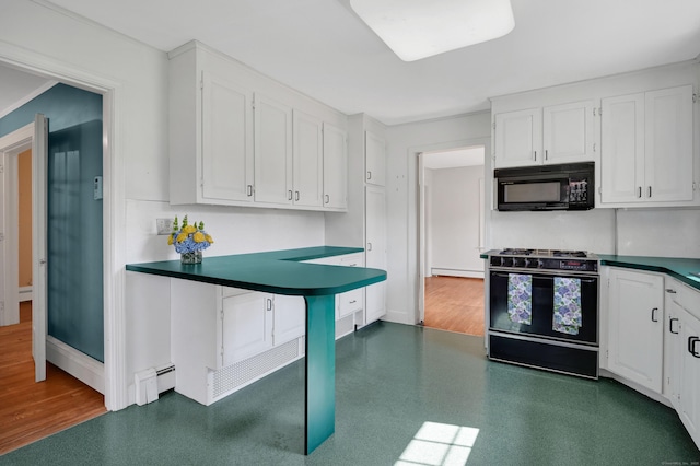 133 Griswold Rd, Wethersfield, CT 06109 - kitchen with black microwave, gas stove, dark countertops, and white cabinetry