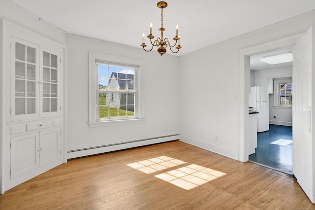 133 Griswold Rd, Wethersfield, CT 06109 - unfurnished dining area featuring baseboard heating, a chandelier, and light wood finished floors