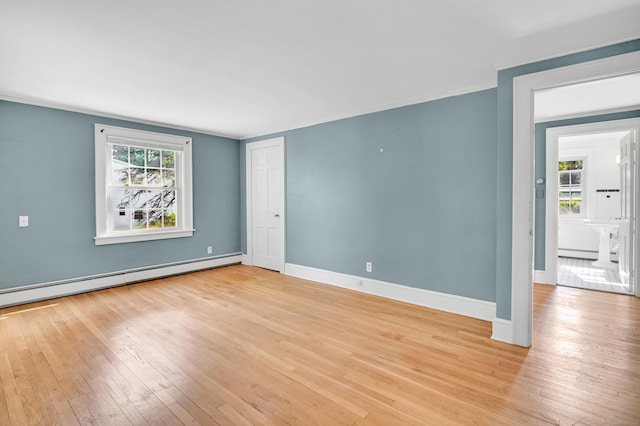 133 Griswold Rd, Wethersfield, CT 06109 - unfurnished room with light wood-type flooring, plenty of natural light, and a baseboard radiator