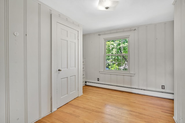 133 Griswold Rd, Wethersfield, CT 06109 - unfurnished bedroom featuring baseboard heating and light wood-style flooring