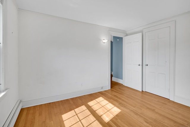 133 Griswold Rd, Wethersfield, CT 06109 - unfurnished bedroom with a baseboard radiator and light wood-type flooring