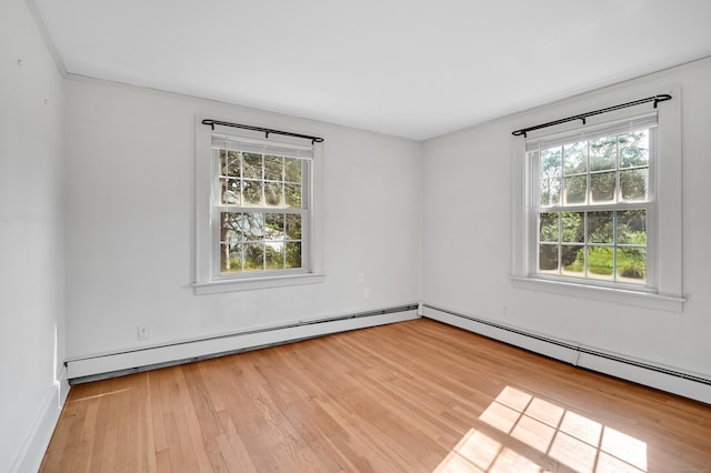 133 Griswold Rd, Wethersfield, CT 06109 - spare room featuring a baseboard radiator and wood finished floors