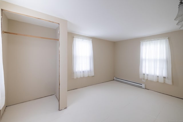 510 S St S, Bristol, CT 06010 - unfurnished bedroom with a baseboard heating unit and a closet