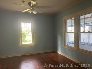 1063 N Main St, Killingly, CT 06241 - spare room with wood finished floors and a ceiling fan