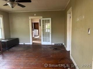 1063 N Main St, Killingly, CT 06241 - unfurnished room with healthy amount of natural light, a ceiling fan, wood finished floors, and ornamental molding