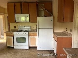 1063 N Main St, Killingly, CT 06241 - kitchen featuring white appliances and brown cabinets